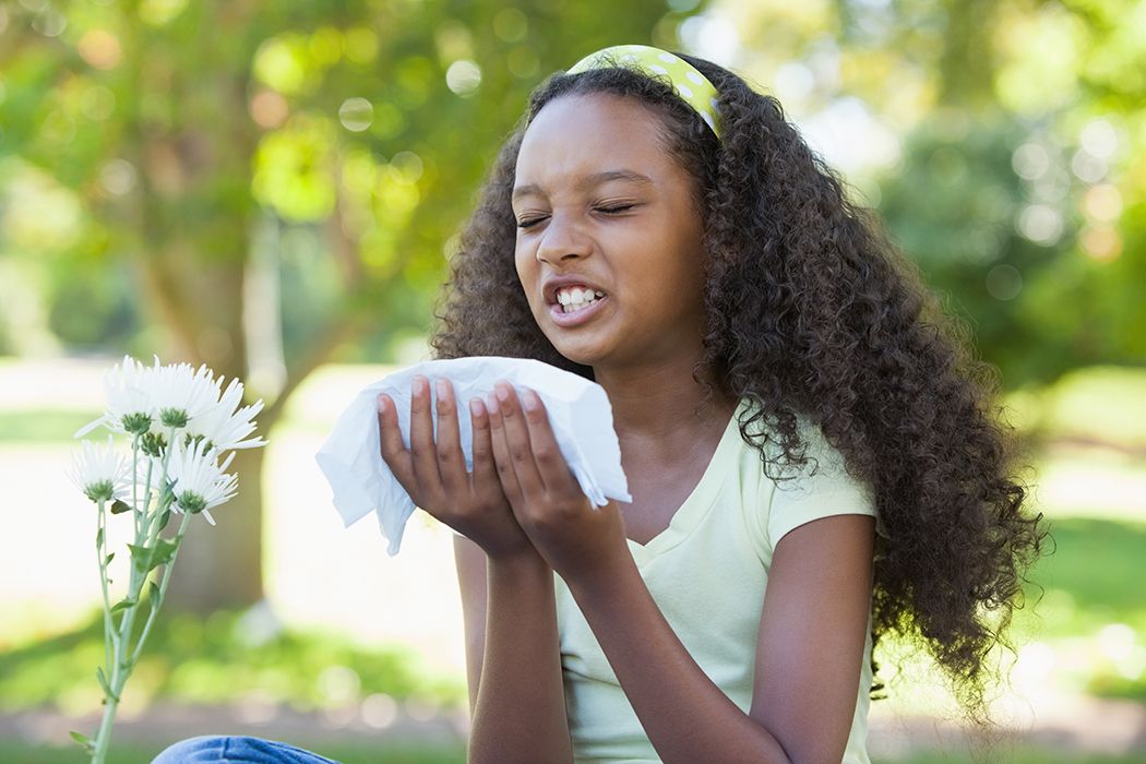 Little girl sneezing