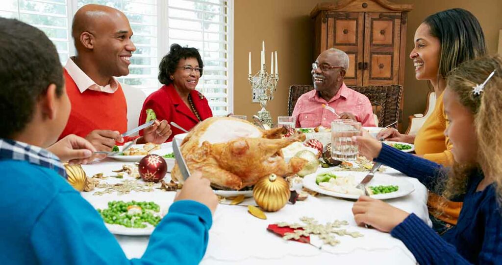 Multi Generation Family Celebrating With Christmas Meal