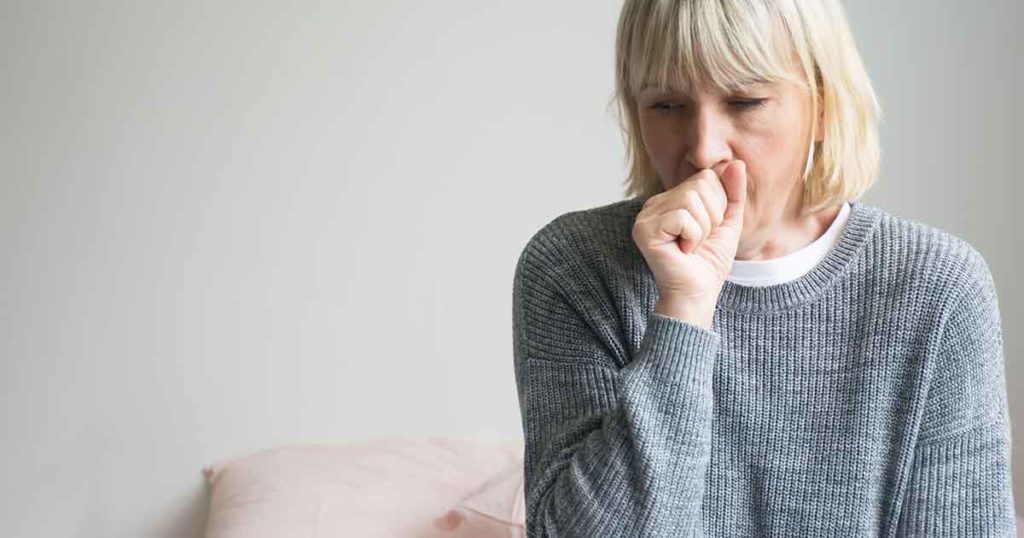 Senior woman is sick, sore throat, cough isolated on white background. Sick woman with sore throat and having cough.