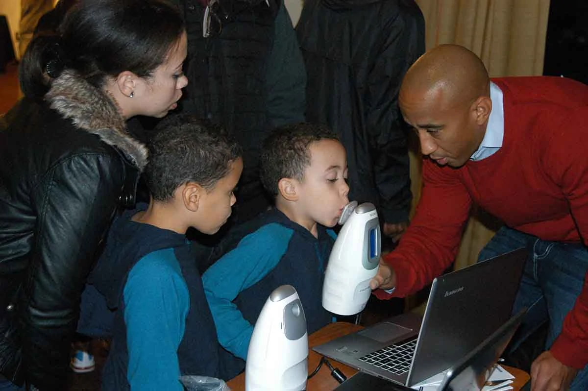 Photo of two boys being tested for asthma